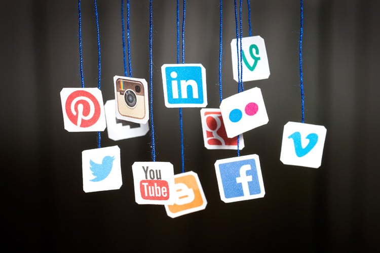 social-media-icons-hanging-from-blue-string